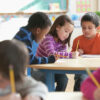 Students working on assignment together in class