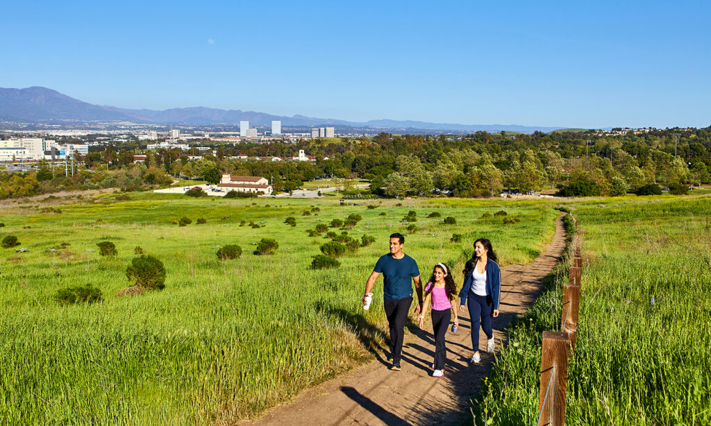 Family hiking through Irvine trail