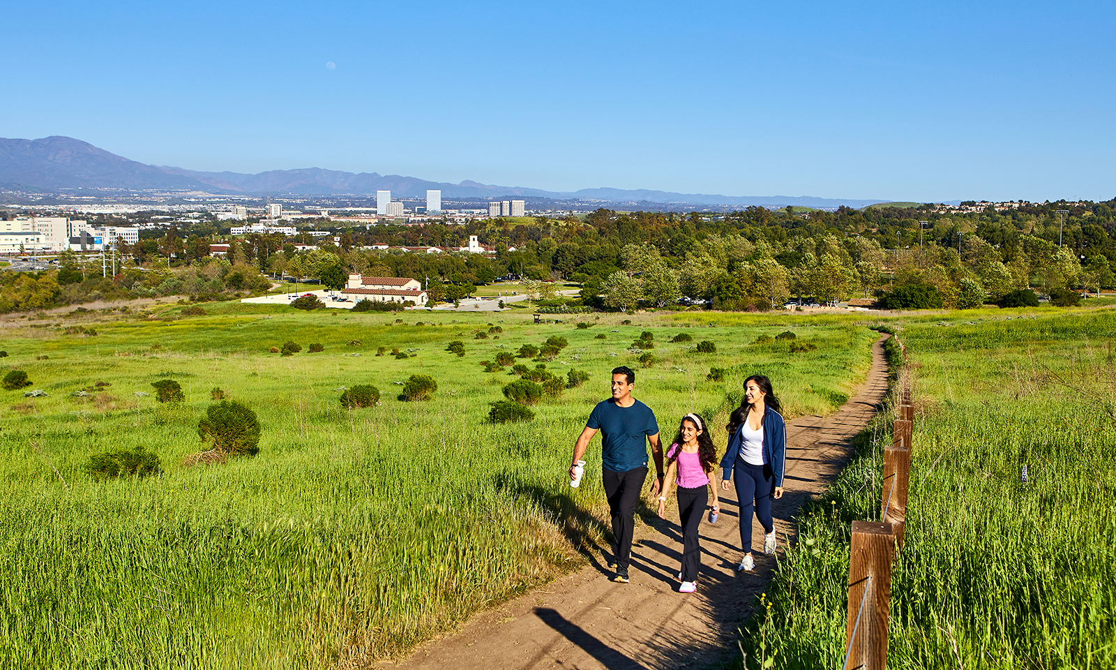 Family hiking through Irvine trail
