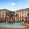 3D rendering of residents lounging around the pool at Colonnade Apartment Homes