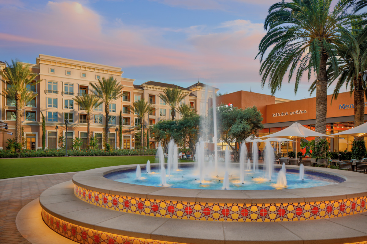 View of Colonnade Apartment Homes from nearby water fountain