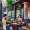 Two women enjoying a meal together at an Irvine restaurant