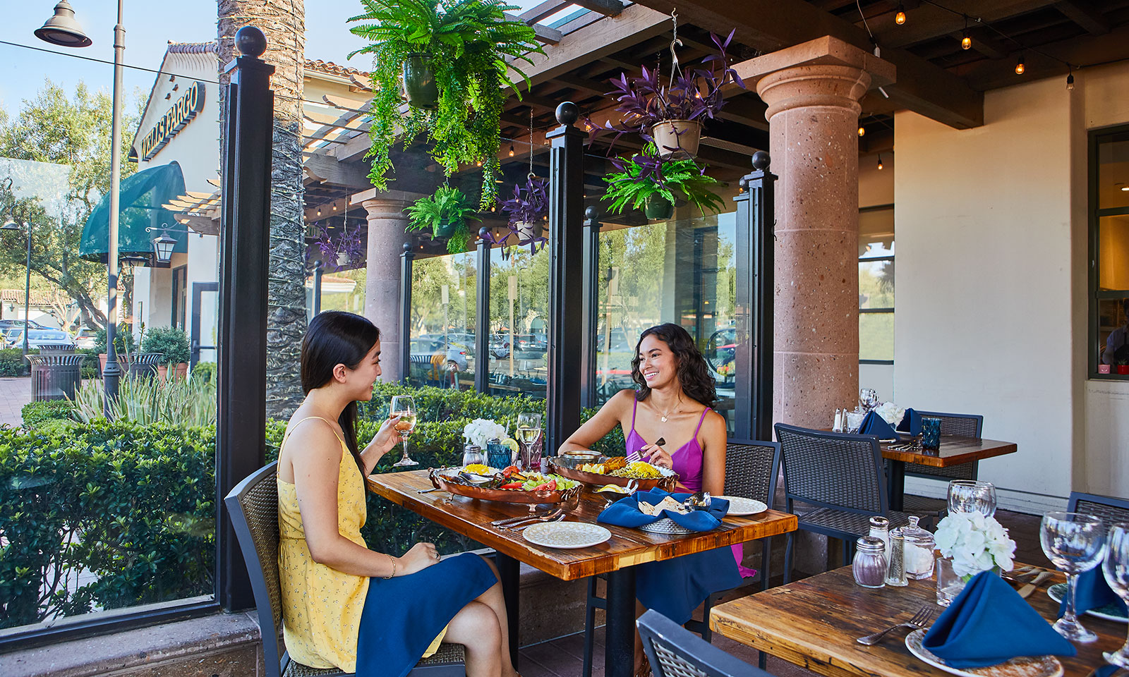 Two women enjoying a meal together at an Irvine restaurant