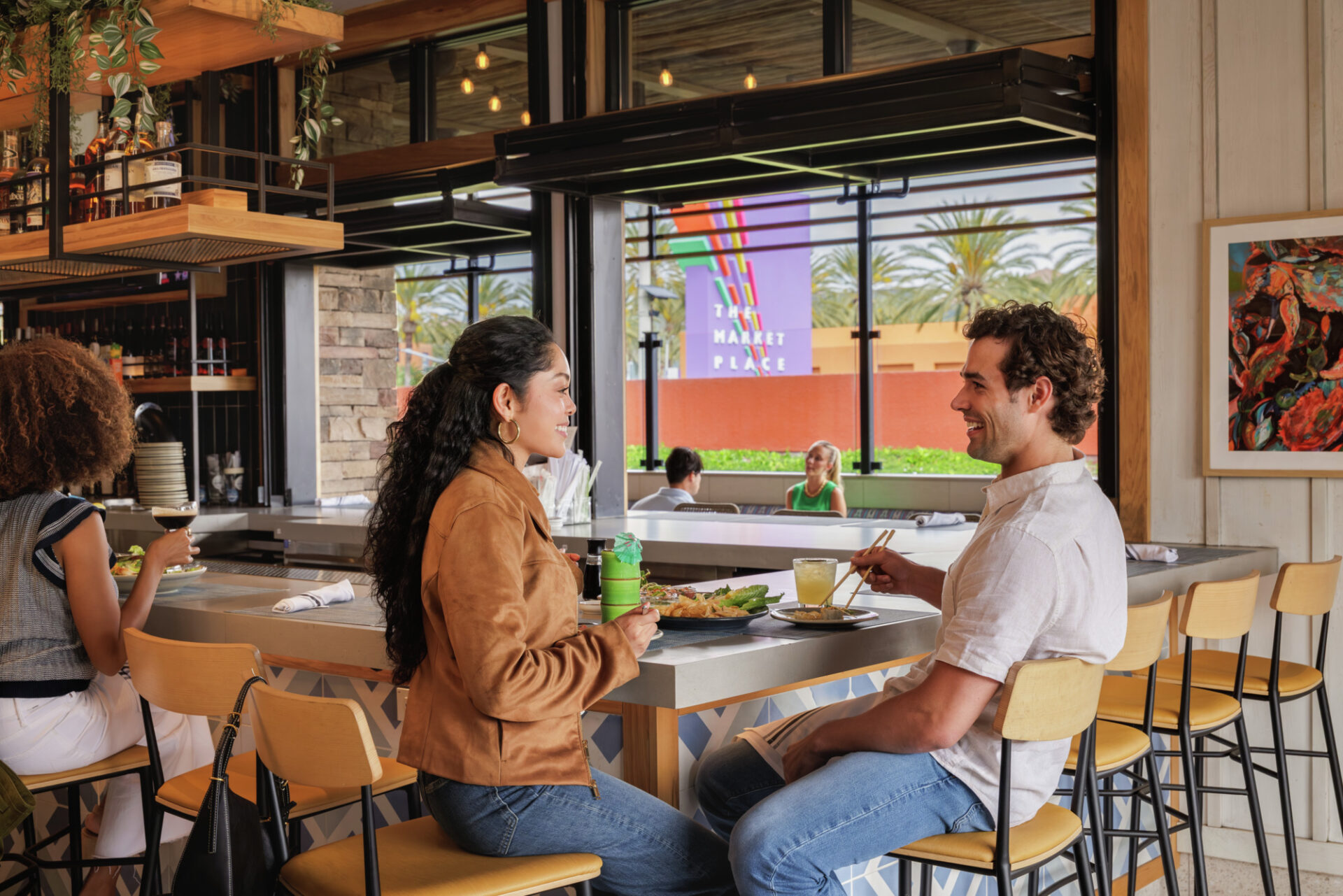 Man and woman eating in a restaurant at The Market Place